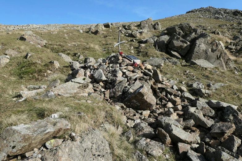 an image of an outdoor fire pit on a rocky hill