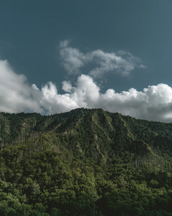 a mountain with a clock in the middle