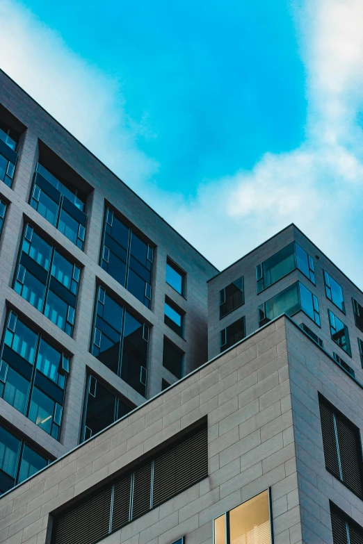 an office building against a bright blue sky