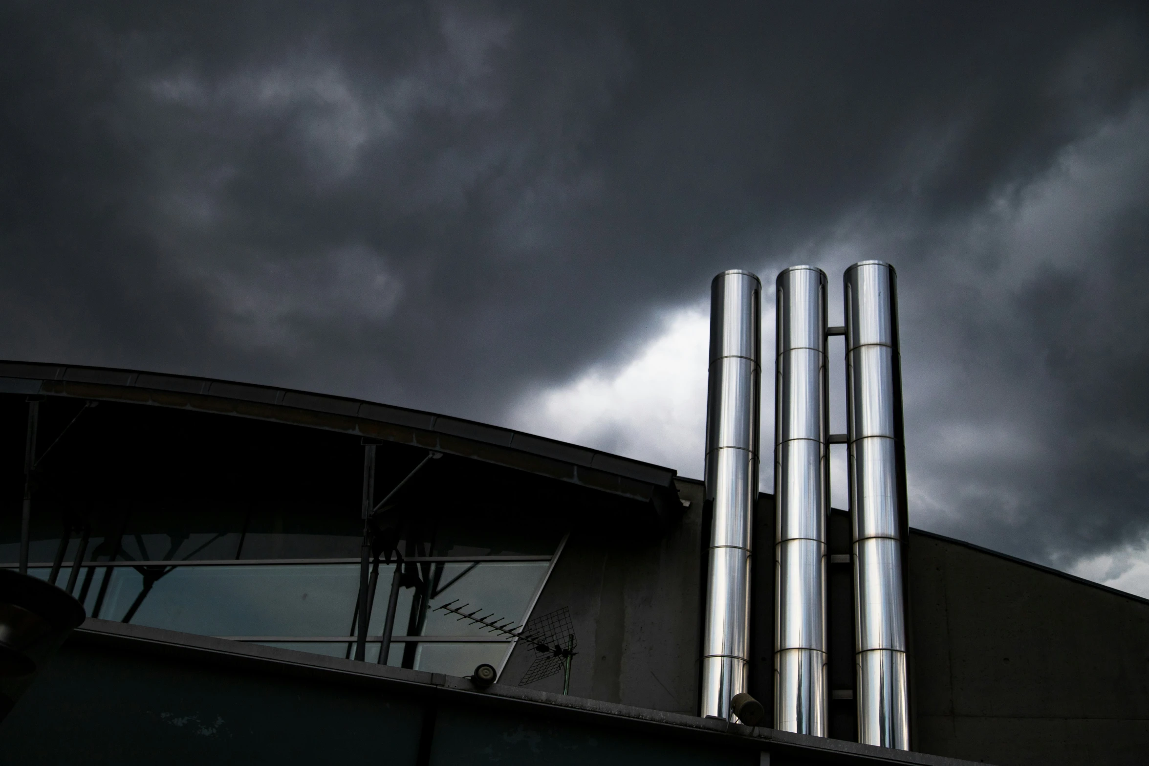 clouds gather over the top of a building