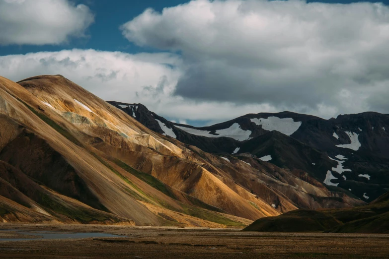 a mountain range with snow and rock formations