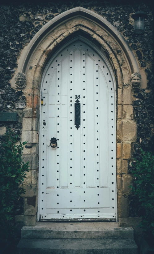 an old building with a large door and large archway