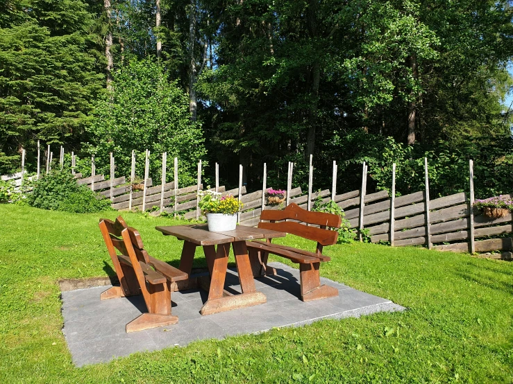 three benches and a table on some concrete