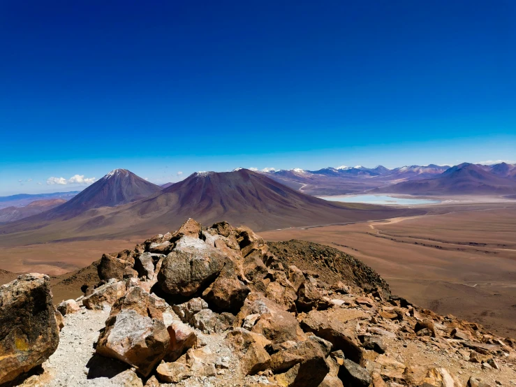 a view of a mountain range with several mountains in the background