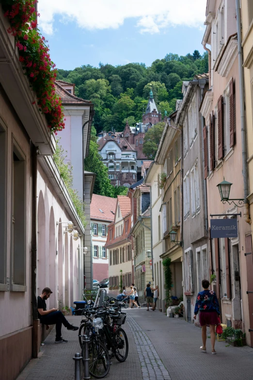 a street lined with buildings and bicycles next to each other