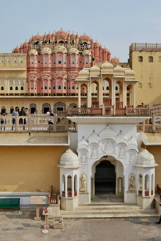 a group of people standing around some buildings