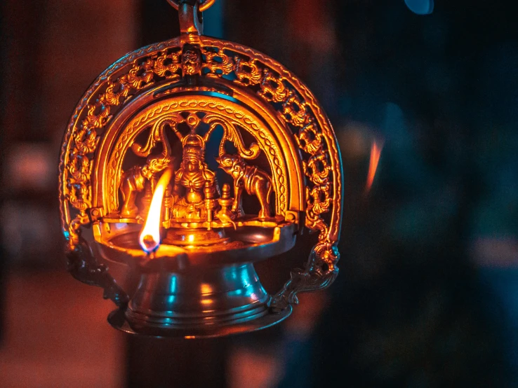 a beautiful golden diyas with candles inside
