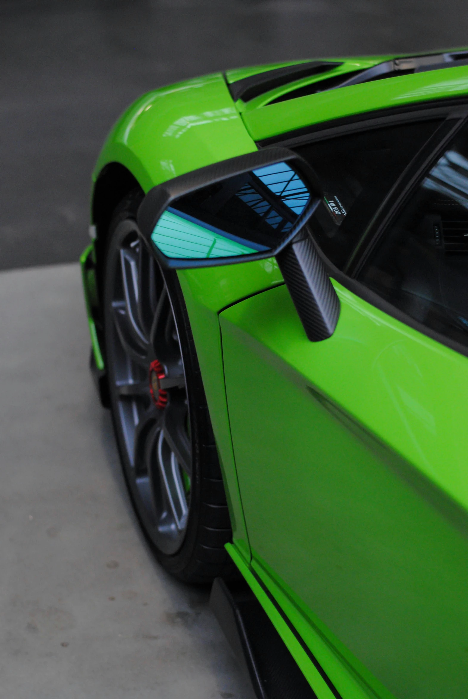 the front view of a lime colored sports car