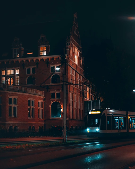 a long building with an outdoor area at night