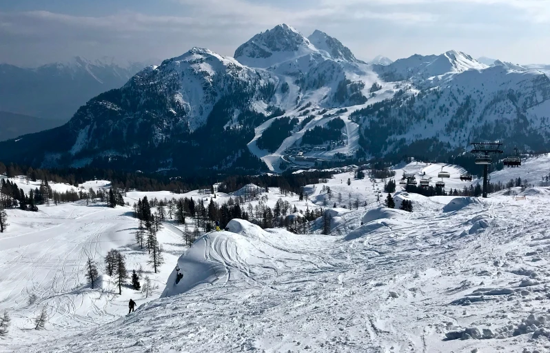 there are a lot of skiers on a snow covered hill