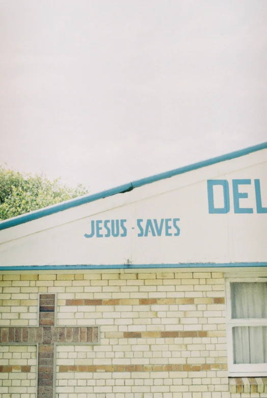 the front of a building with a cross on top