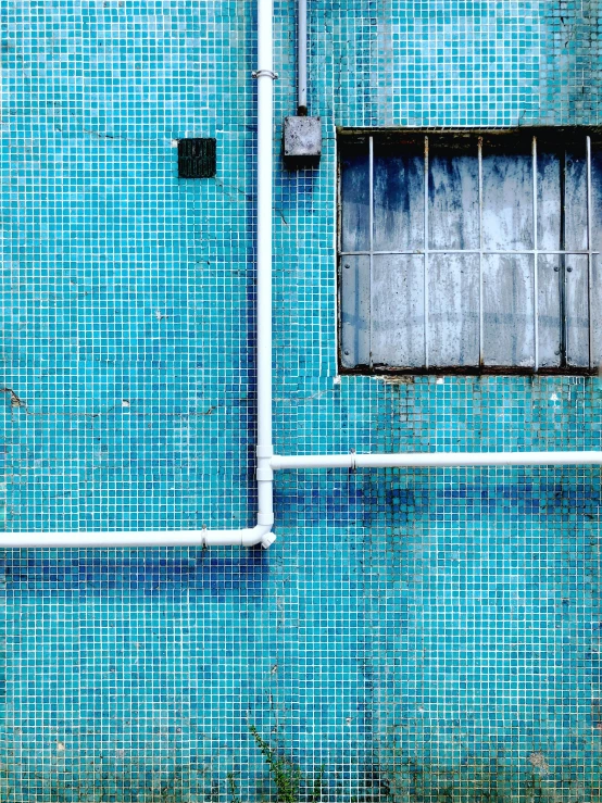 a picture of a building with a blue wall