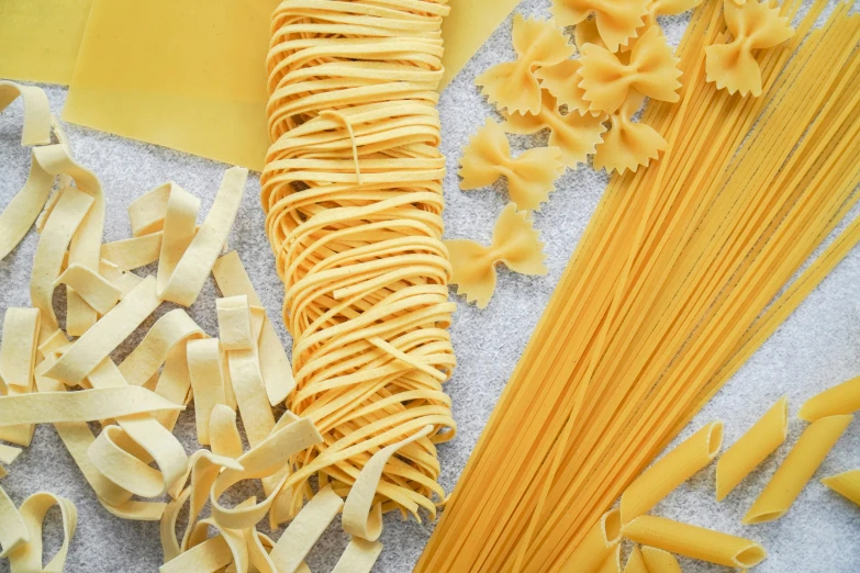 pasta and other ingredients laying on a table