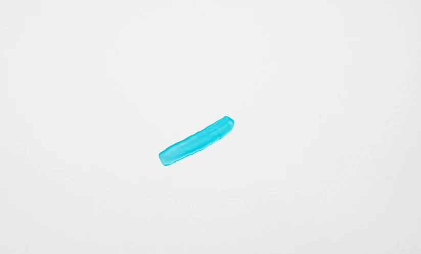 the view of blue tooth brush over white paper