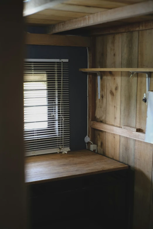 some kind of kitchen with a lot of wooden cupboards