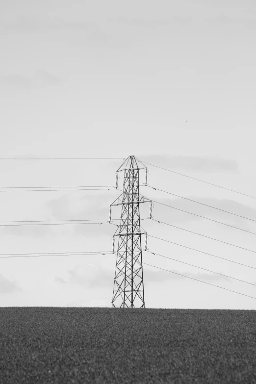 a power line on a field in the middle of the desert