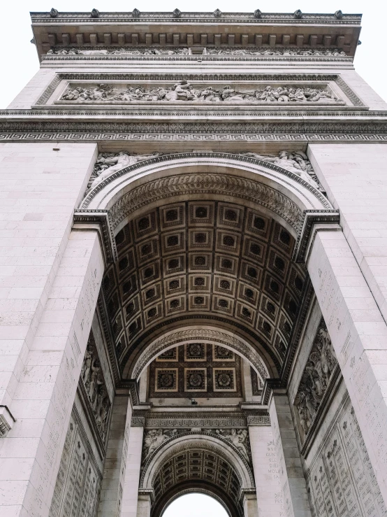 an archway to a building that looks like it is made from cement