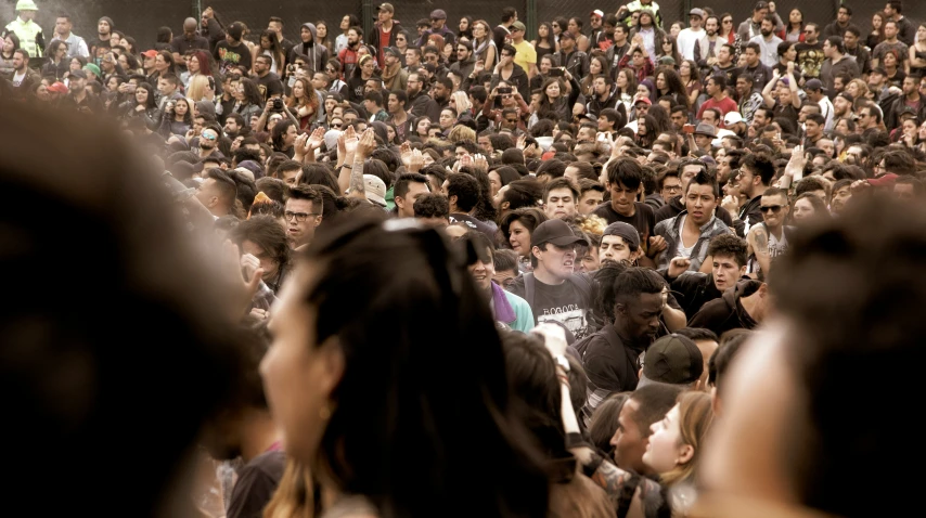 a group of people in front of a crowd