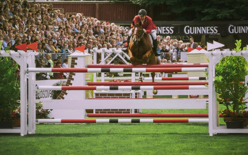 a man is riding a horse in an arena