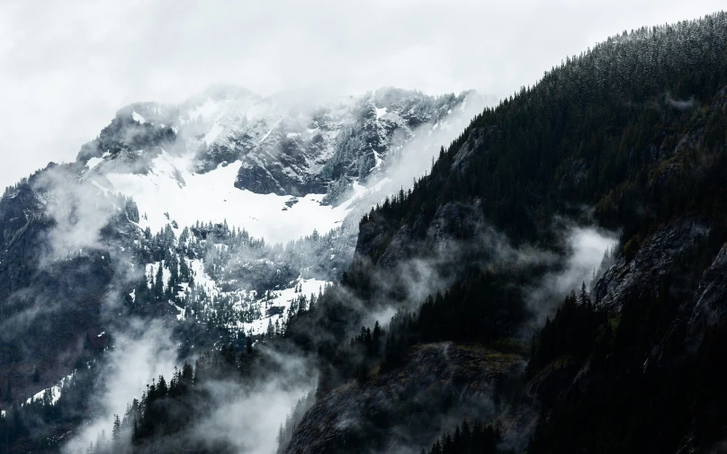 a mountain in the fog covered area