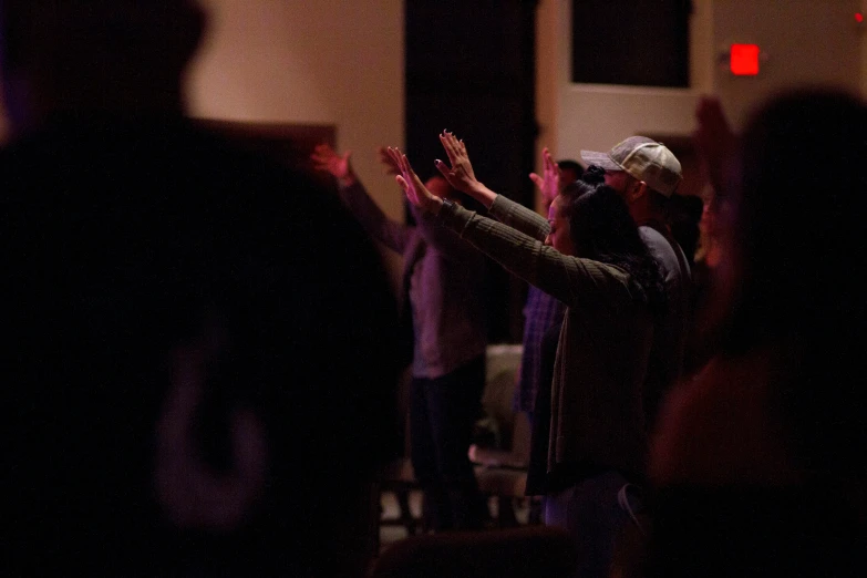 a crowd of people standing next to each other