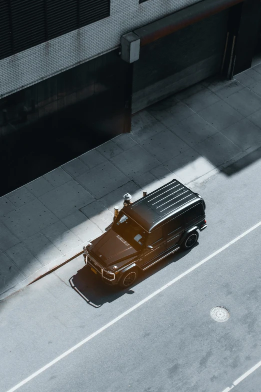 a truck traveling down a street next to a building