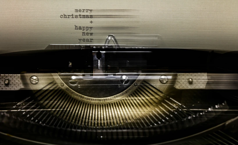 a close up of a typewriter with writing on the back