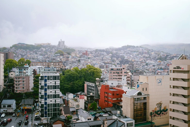 cityscape in an urban area with mountains in the background