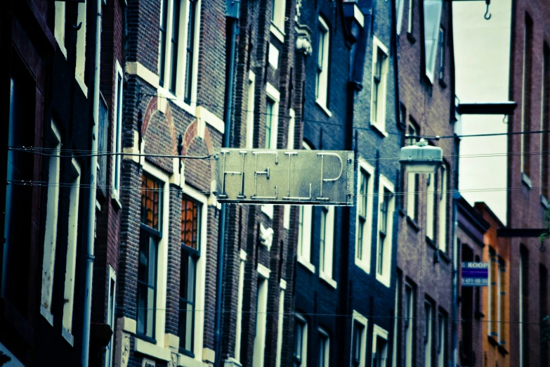 an image of street signs attached to building in city