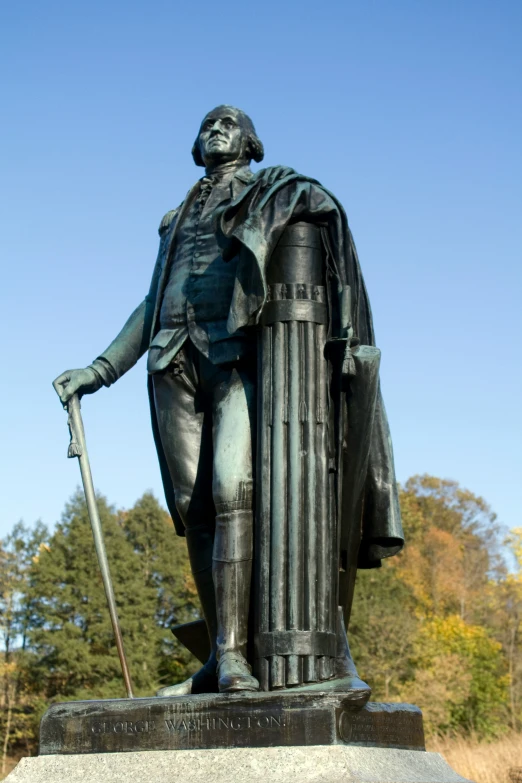 the statue is shown with a spear in his hand