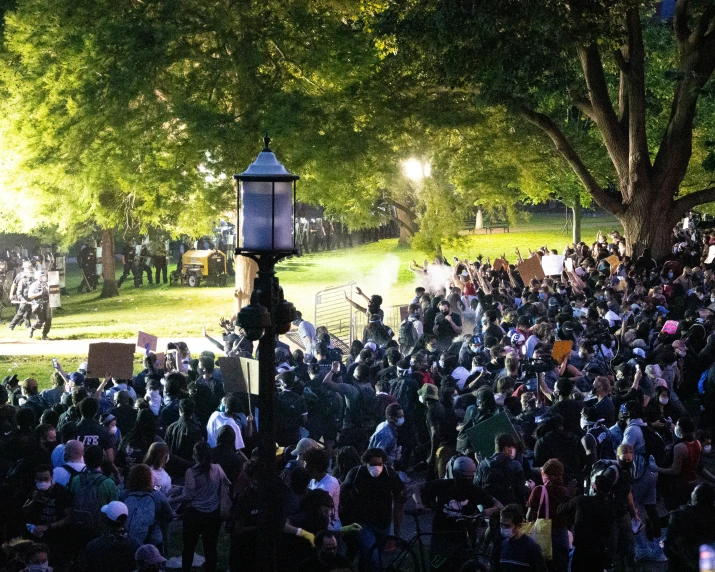 a crowd of people are gathered together outside