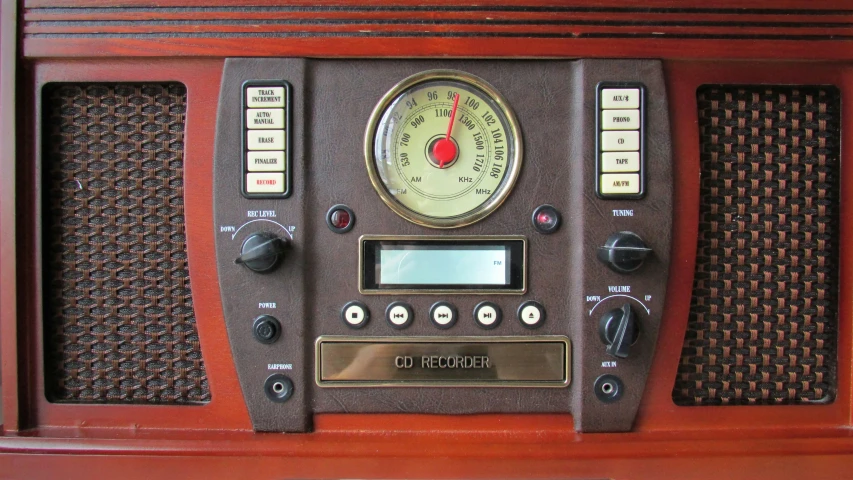 an old - fashioned radio with dials and two different gauges