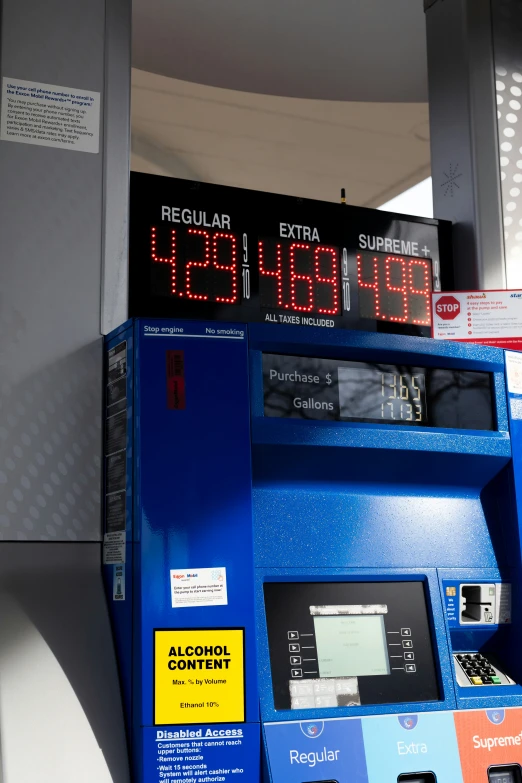 a blue gas pump is on display with digital displays