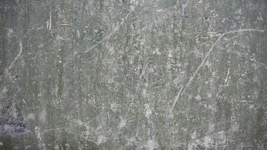 the concrete is worn and weathered with many patterns