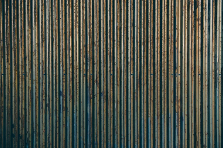 a rusty grungy wall in the middle of an empty area