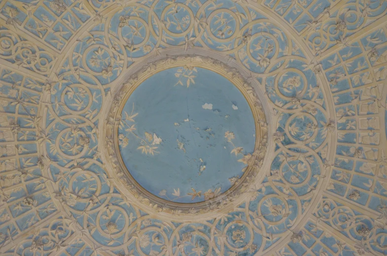 the round shaped painting on the ceiling is all painted blue