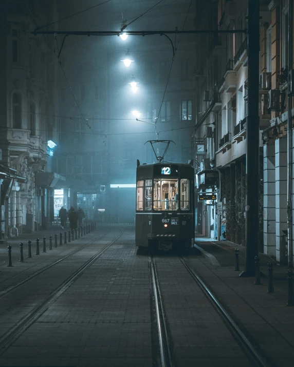 the trolley is coming down the train tracks