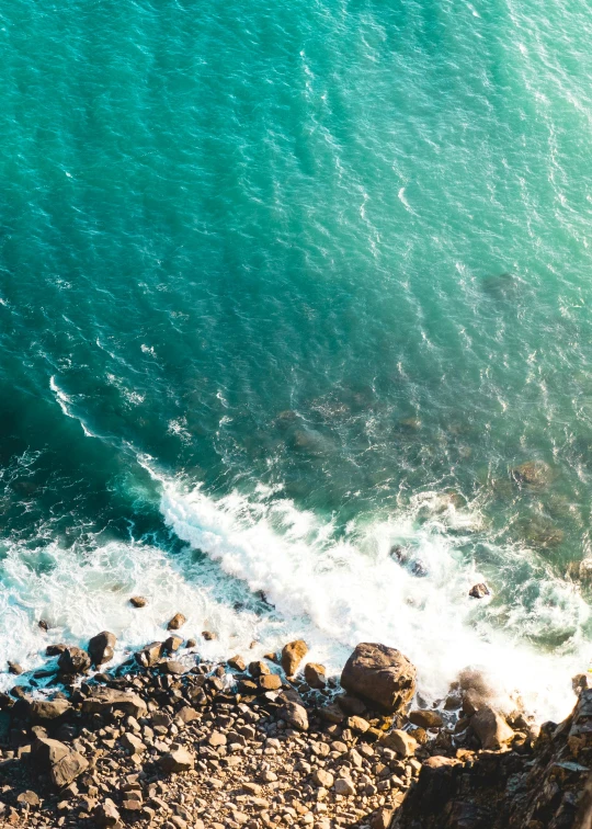 a body of water is next to a beach