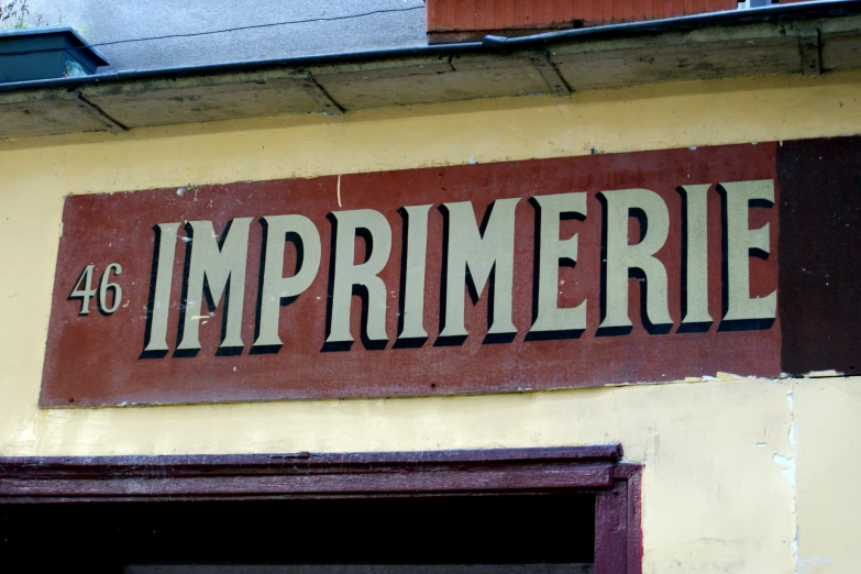 a large sign for a restaurant saying it is in the front of a building