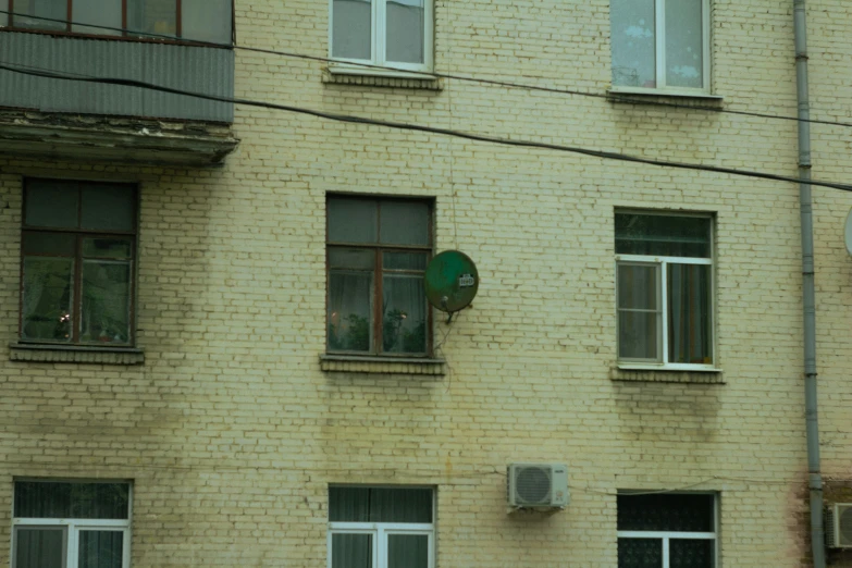 a building with windows and lots of windows next to a street