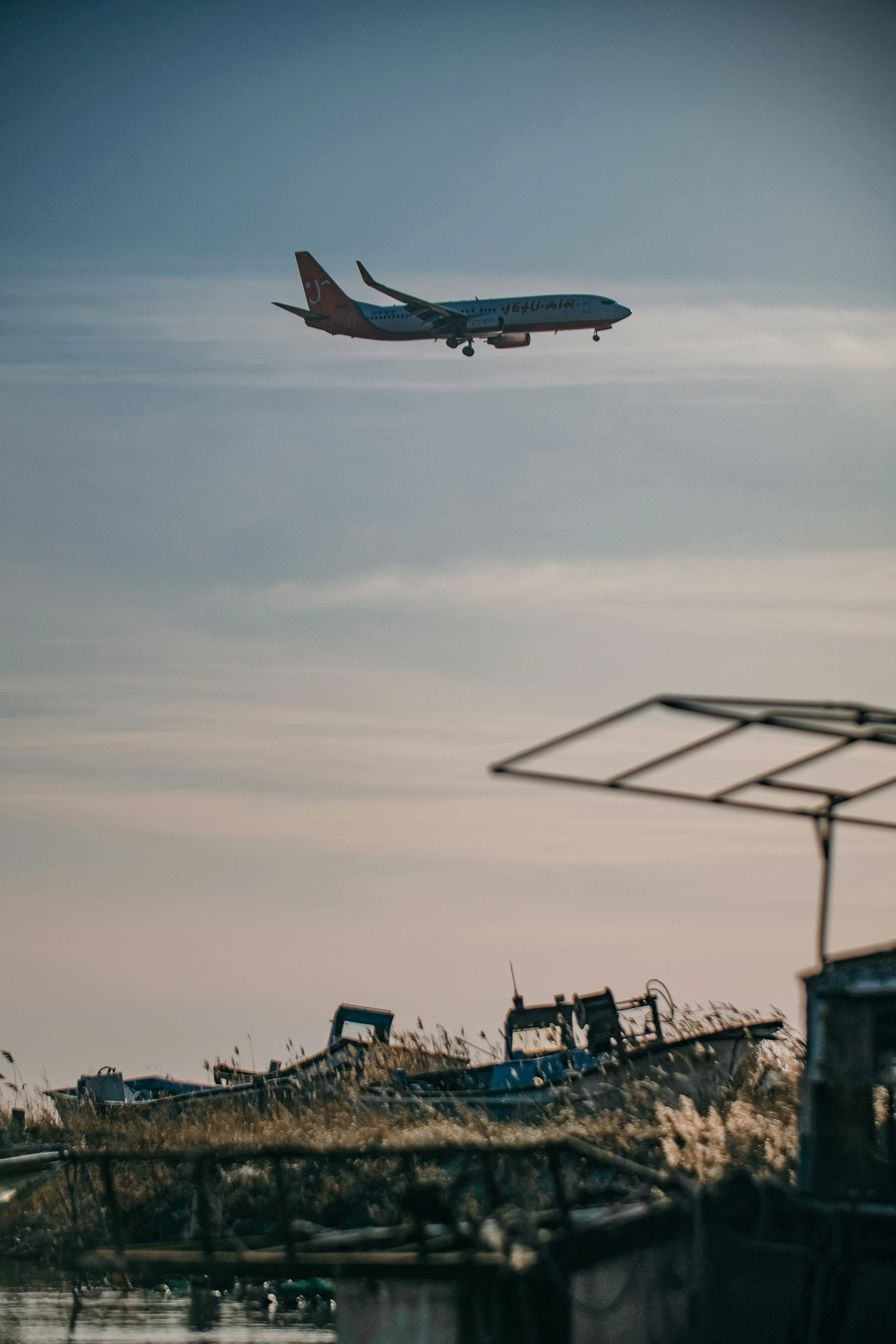 an airplane taking off from a runway in a field