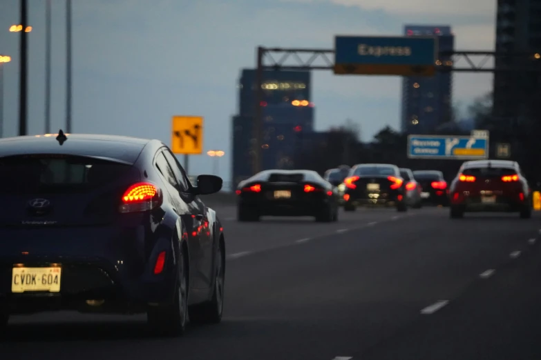 cars are riding down the highway as seen from behind