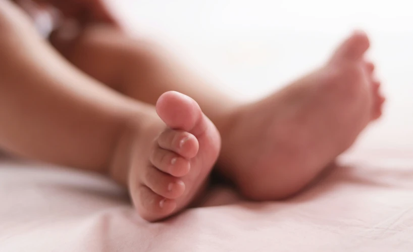 a close up view of a person laying on a bed