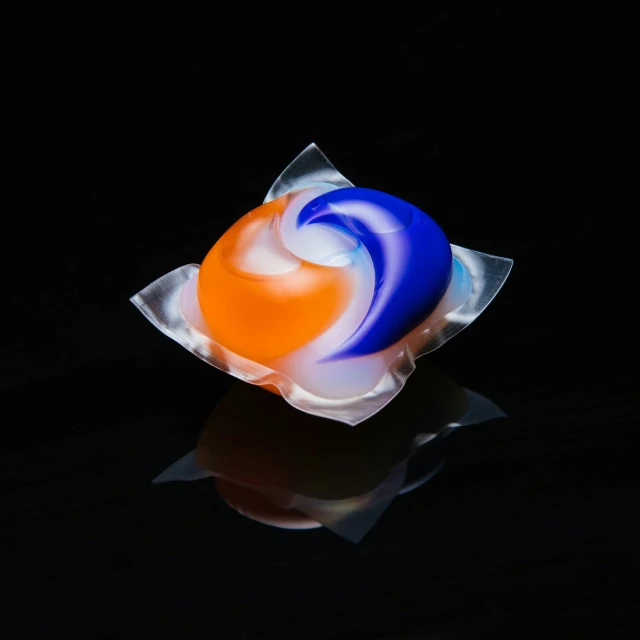 an item of colorful swirls sits on a reflective surface