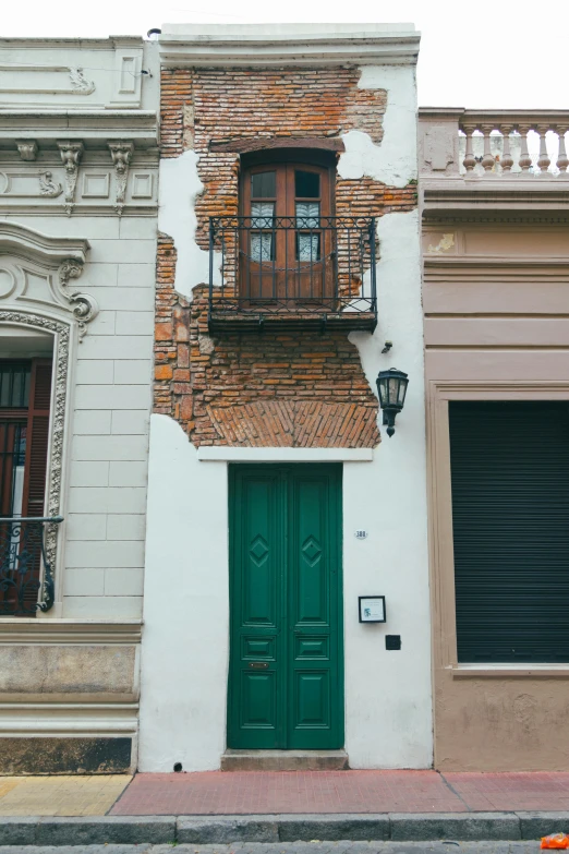 a building that has green doors and windows