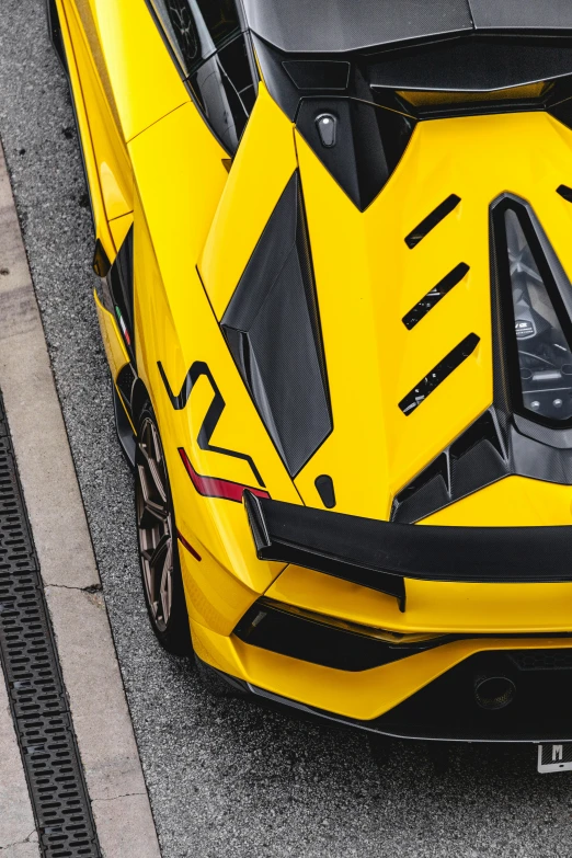 a yellow sports car parked in a parking lot