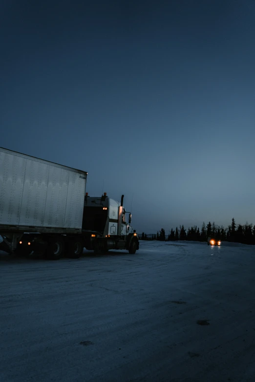 two large trucks parked next to each other