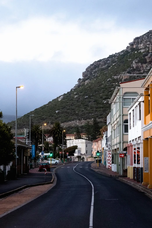 an empty street lined with many colorful buildings