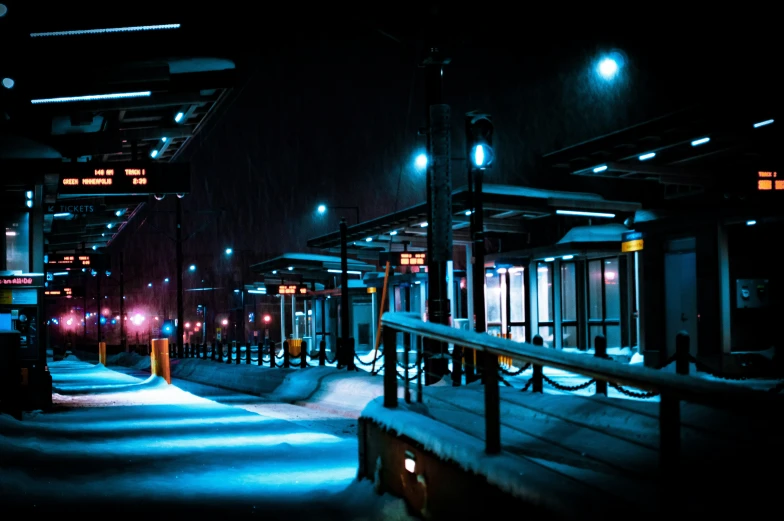 street lights lit up on a snowy night