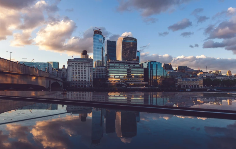 a body of water with buildings in the background